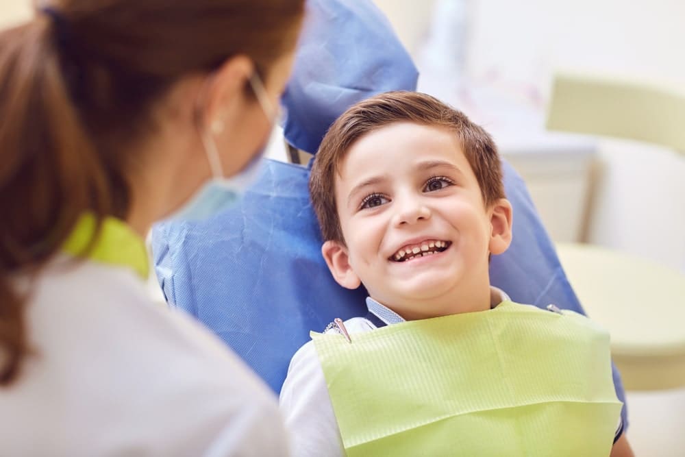 pediatric dentist with patient